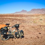 Bike loaded in the surreal landscape of Brandberg West